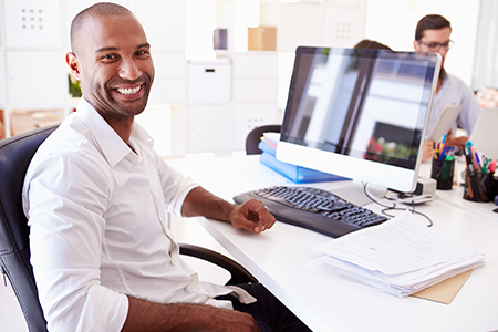 Man sitting at a computer.